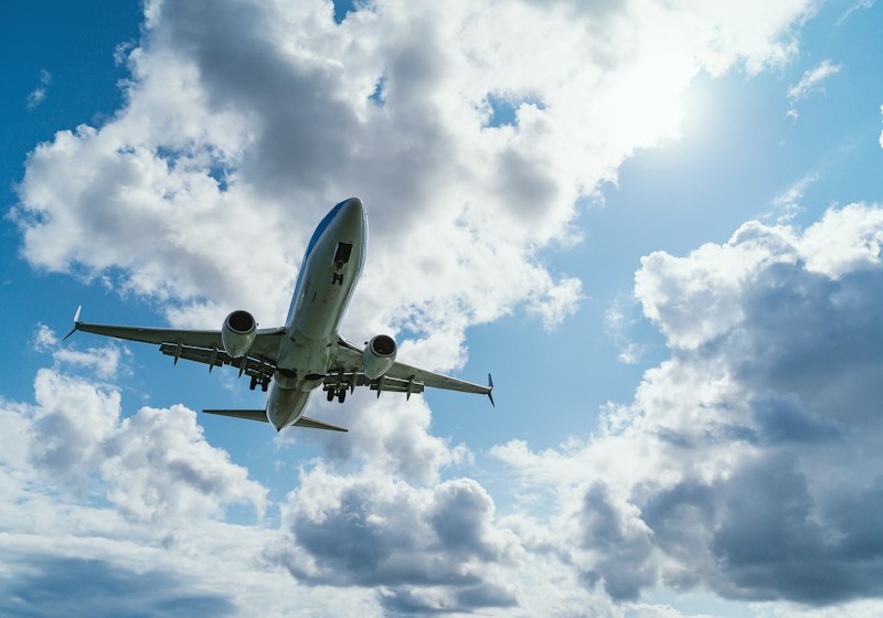 Passenger airplane flying through the clouds